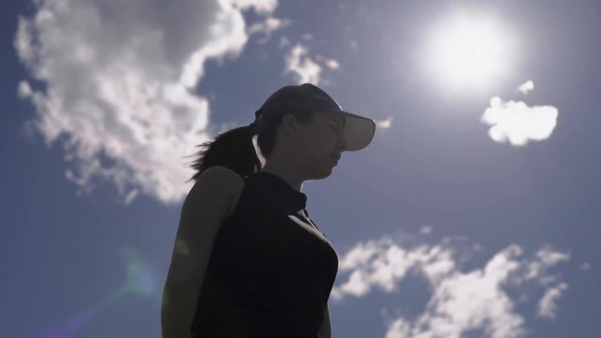 Wind-blown Clouds Floating Over Woman Outdoors on Windy Day, Atmospheric Footage Clip.