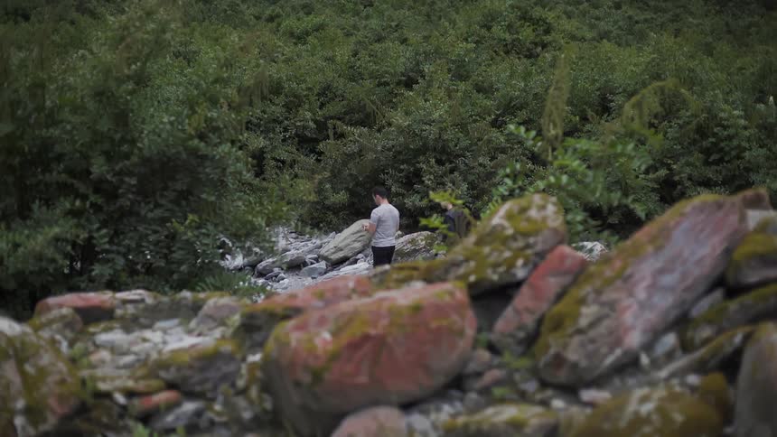 Person Hiking Through Rocky Mountain Trails - Outdoor Adventure Footage in Mountains.
