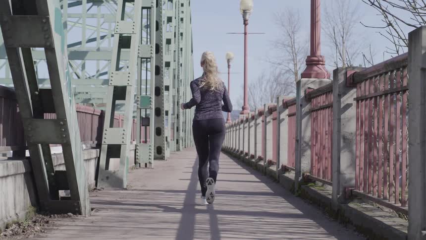 Girl running on the bridge