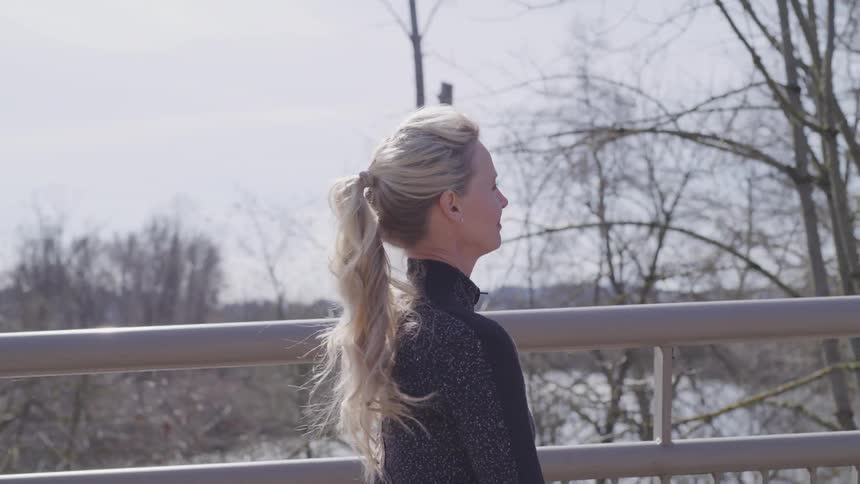 Girl walking on a bridge