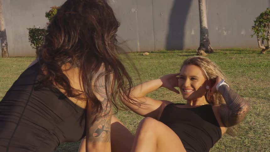 Two women work out together