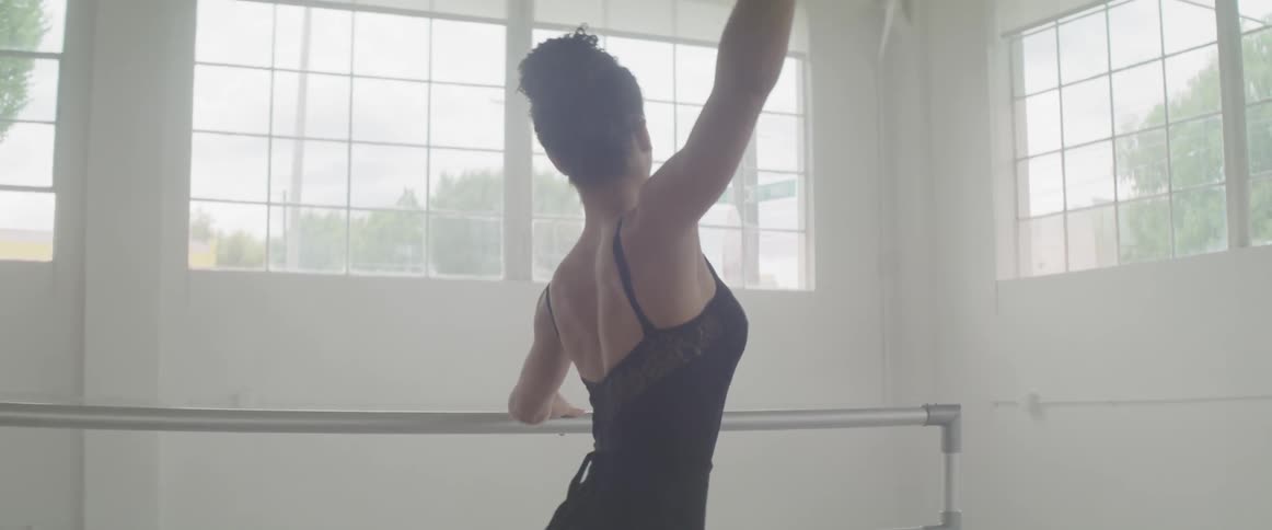 A woman stretches from left to right
