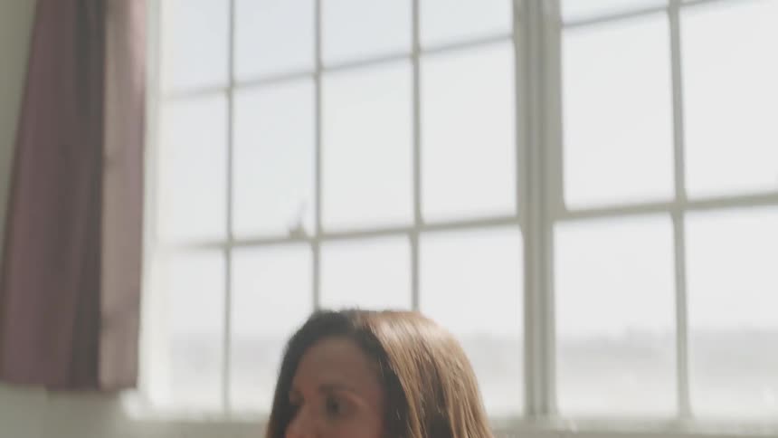Girl working out in front of a window