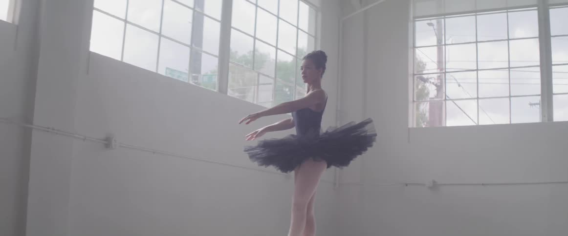 A ballerina do ballet exercise in the hall