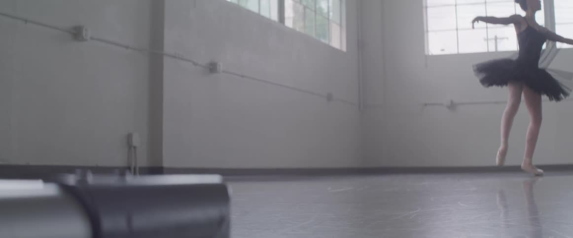 A ballerina dancing in a dance studio