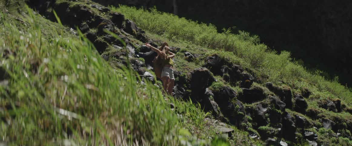 A woman is stretching outdoors