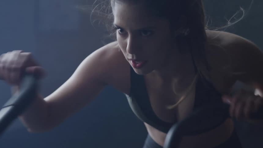 Girl working on a elliptical
