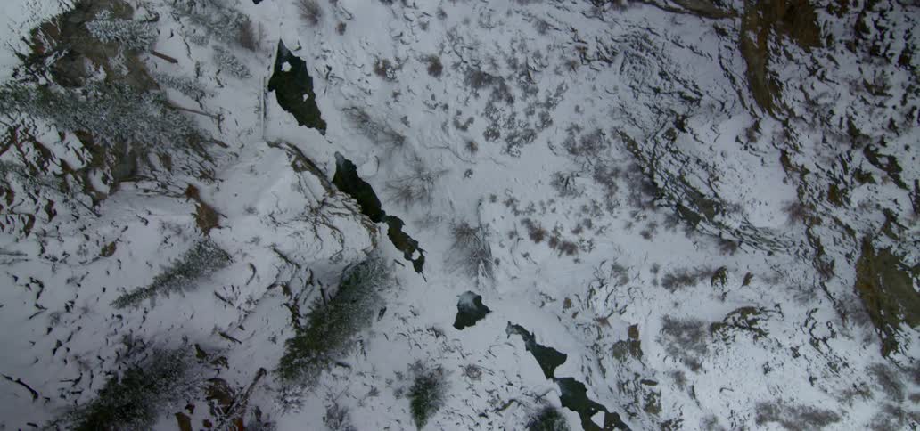 A bird eye view of snowy mountain