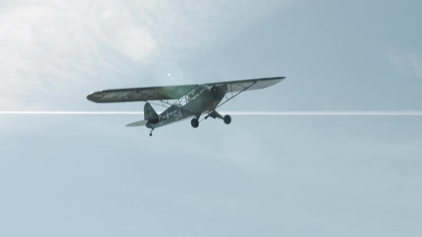 A plane maneuvering at the sky