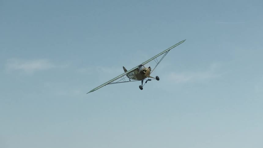 A small sized airplane maneuvering at the sky