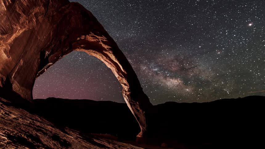 A time lapse scenery of a starry night at the desert