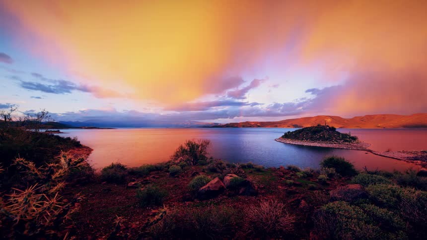 The clouds move quickly over the island shore