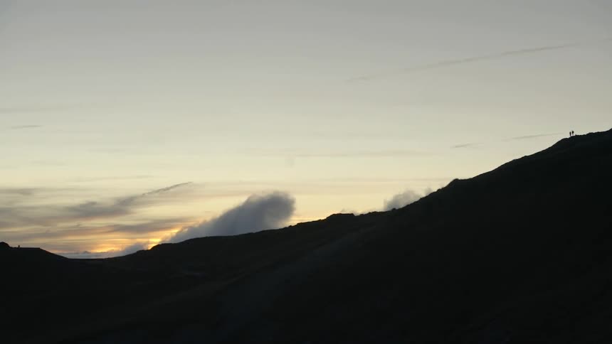 Smoke fills the sky over the mountain