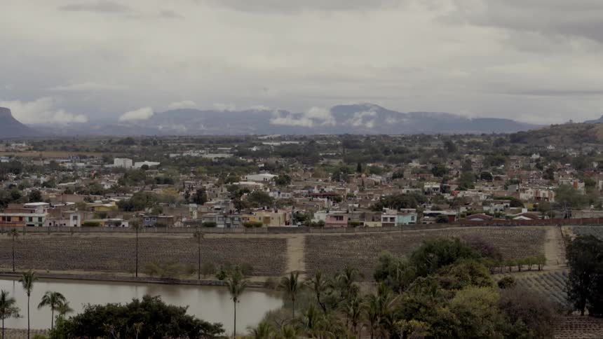 Landscape view with a river in front of a neighborhood