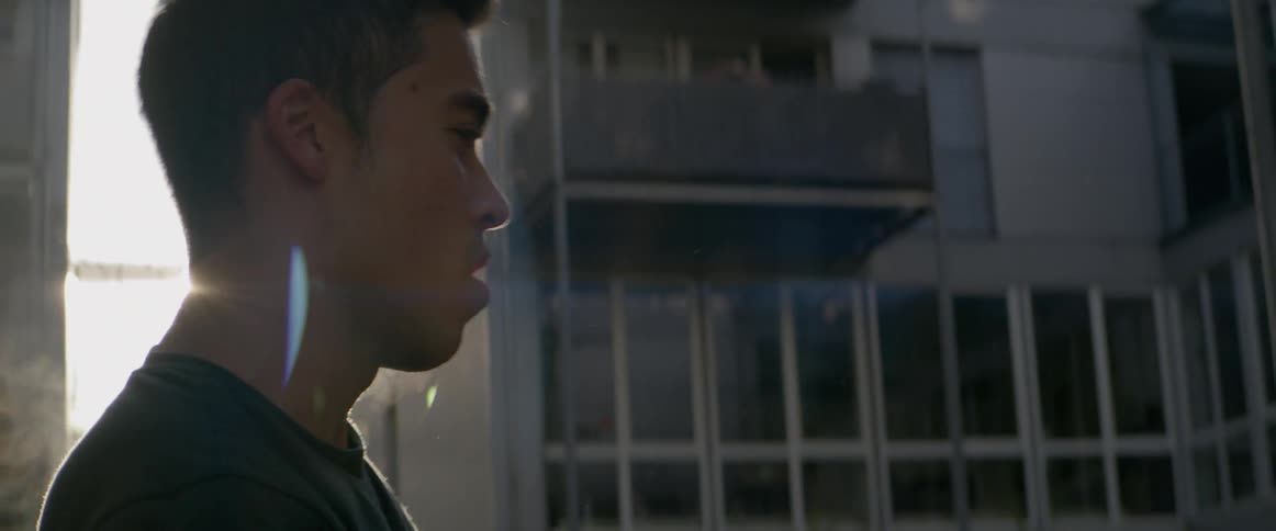A young man dances in the street