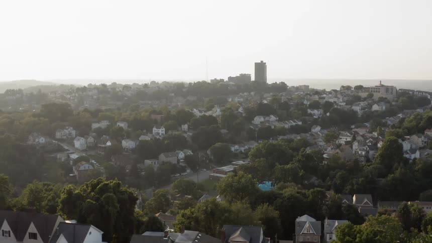 A suburban neighborhood full of houses near a city