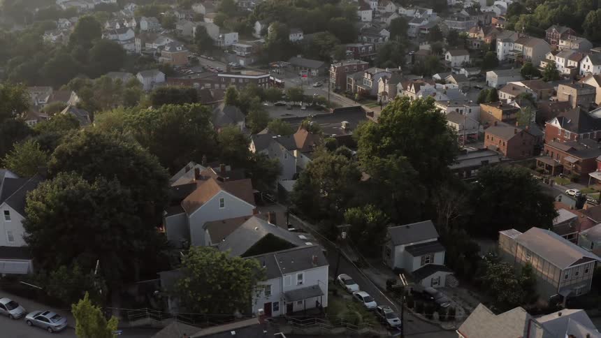A neighborhood with houses trees and roads