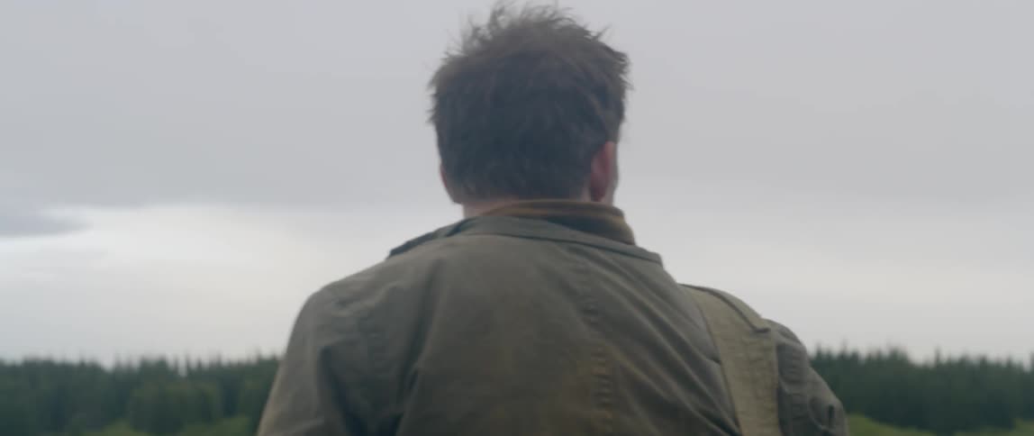 A man searches outside for something