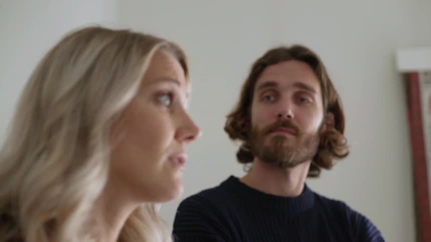 Man and woman are discussing and look their house surrounding