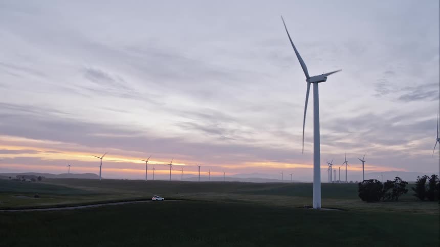 Wind combines spin in a field at dusk