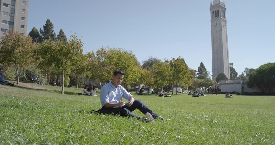 A man writes is the grass