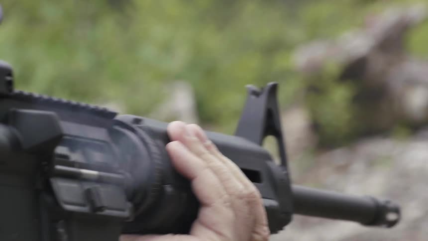 A person shoots a semi-automatic weapon