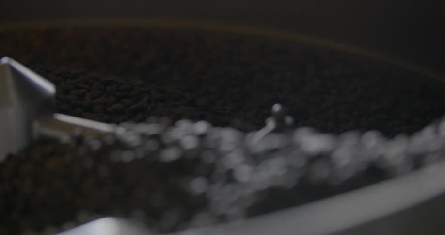 A machine is grinding coffee beans