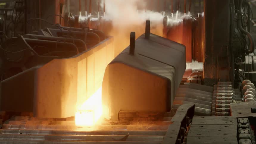Metal going down a conveyor belt in a factor