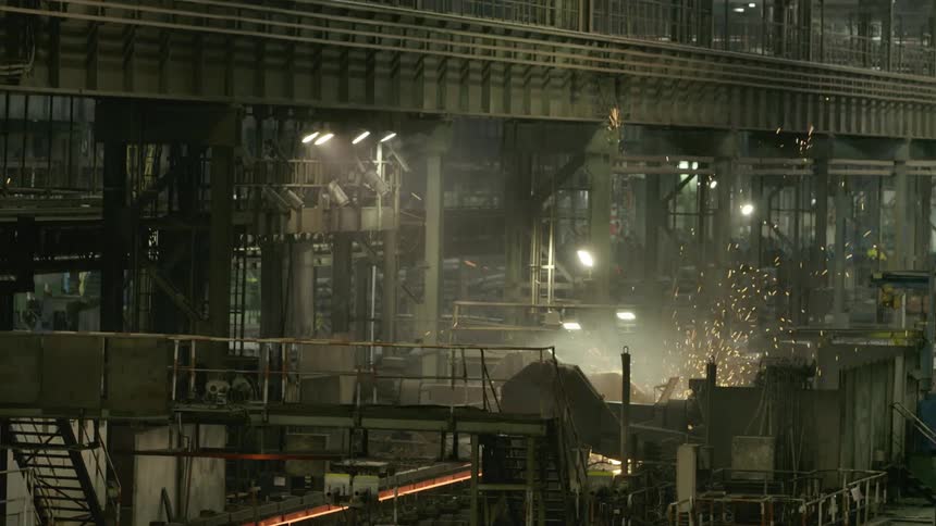 Steam and sparks fly in the manufacturing plant