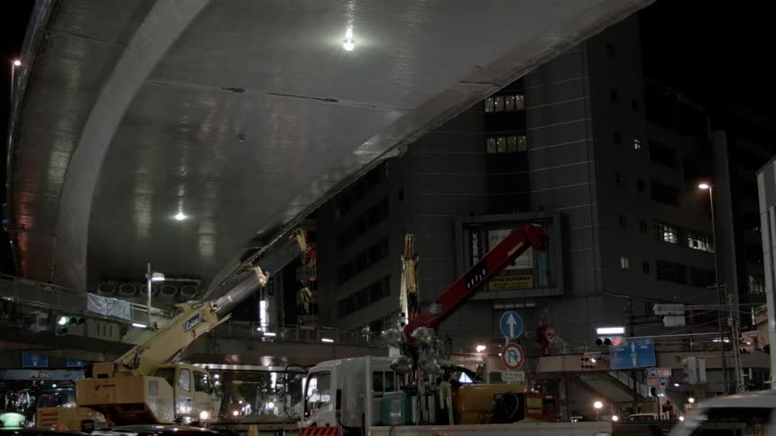 Vehicles going under a bridge