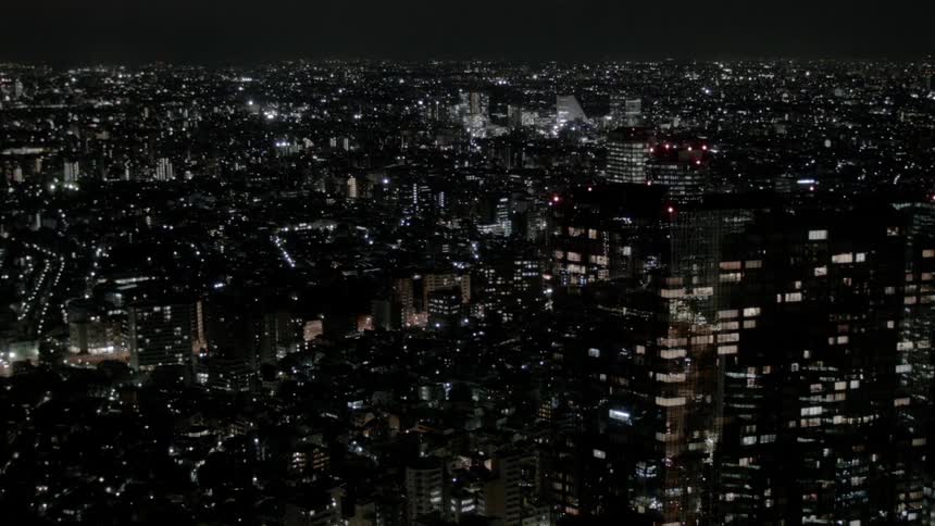 A city at nighttime with buildings and lights