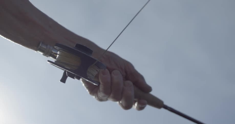 A man using a fishing pole