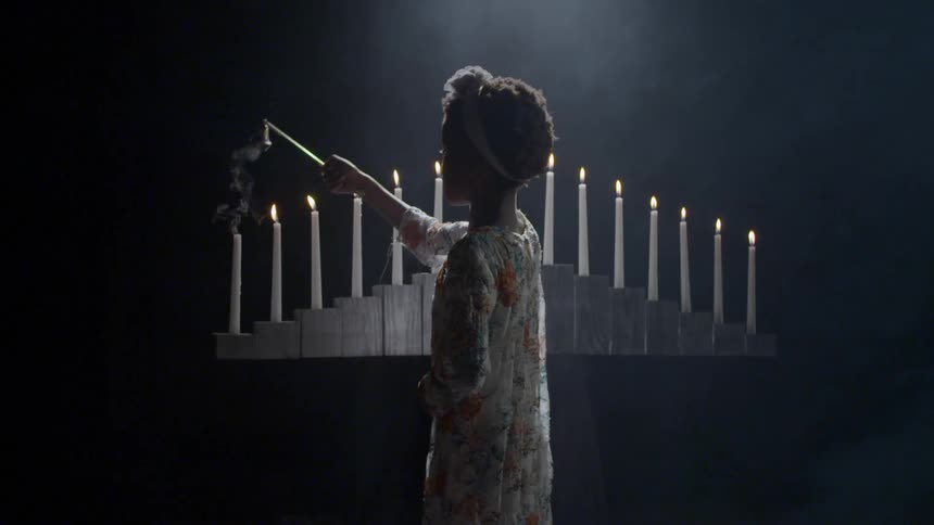 Girl lighting candles