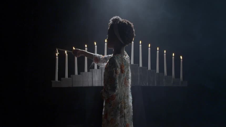 A child is lighting candles