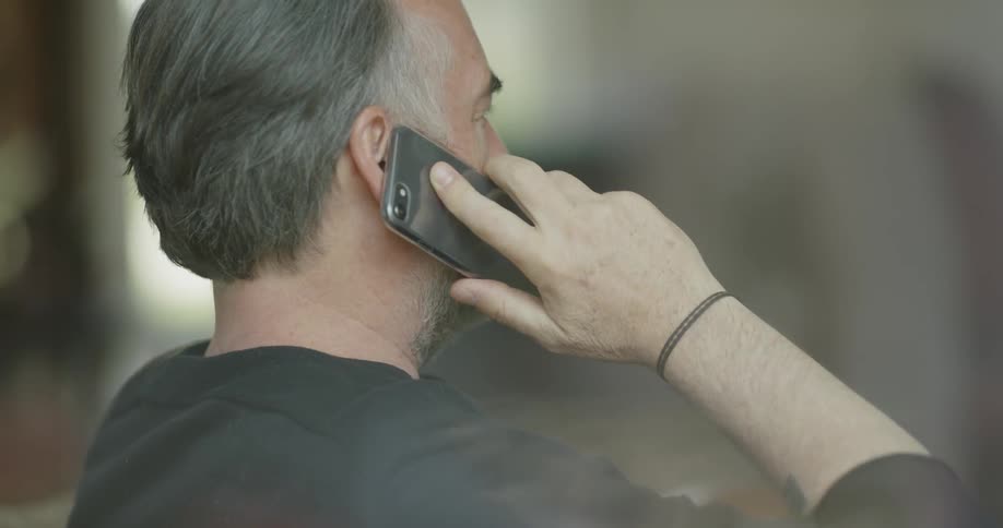 Man talks on cell phone