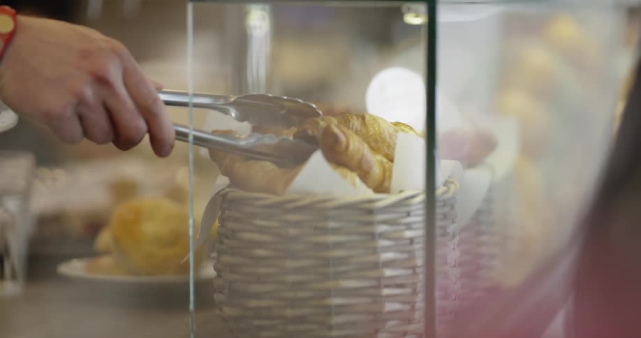 A person is grabbing a dessert while using utensils