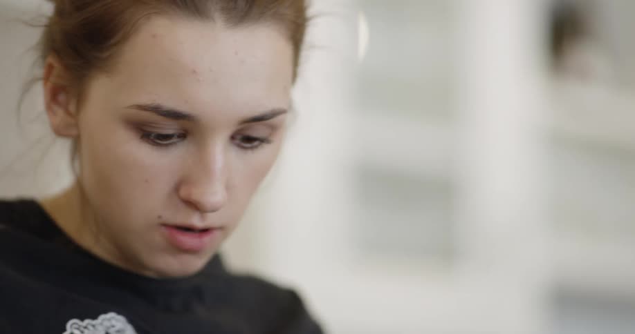 A woman looking around and talking