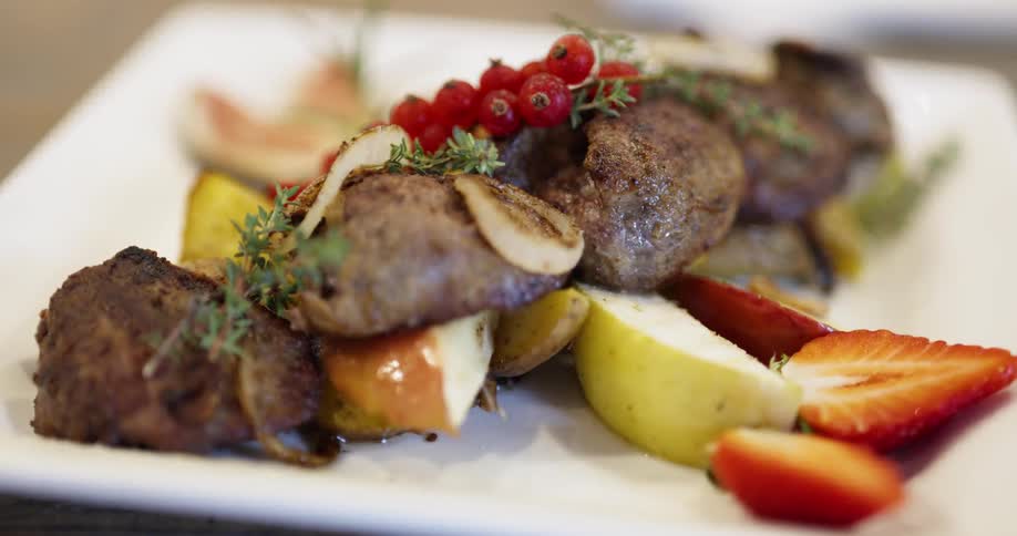 A square plate of food on a table