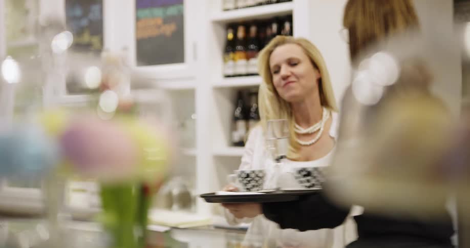Woman being served items