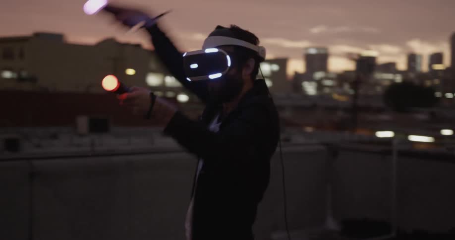 A man is using virtual reality on the roof