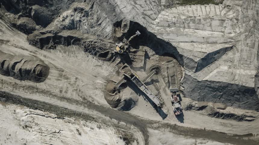 Equipment moves dirt and gravel around