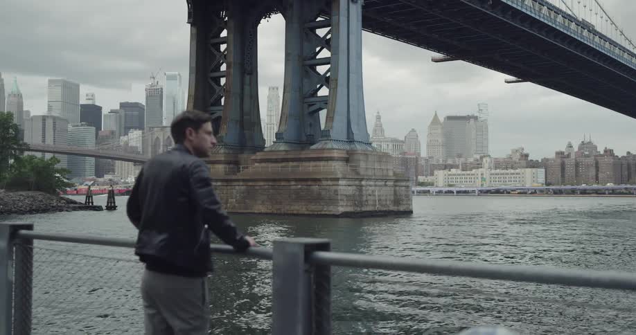 A man is looking at the ocean view
