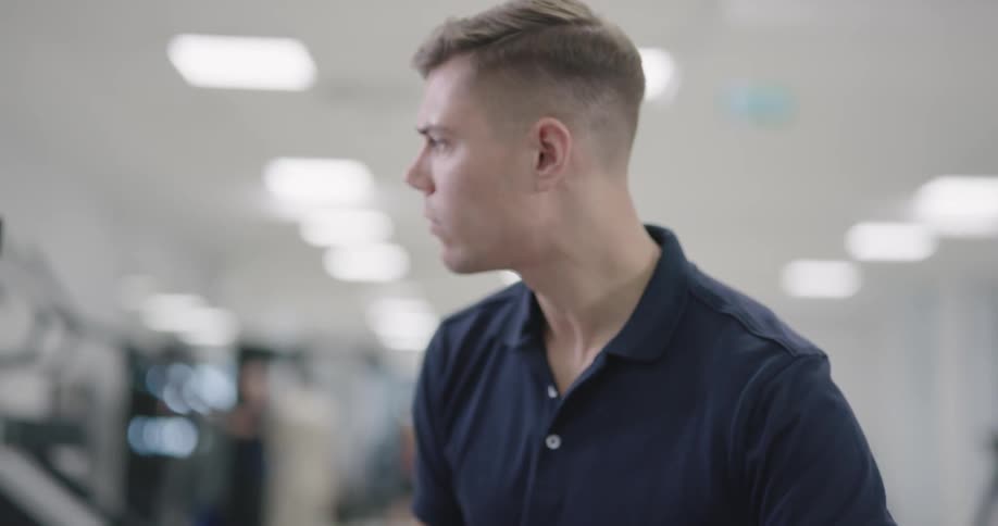 Male looking at something at the gym