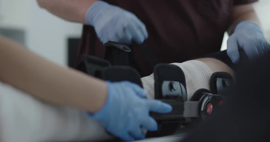 Man leg being taken care by a therapist