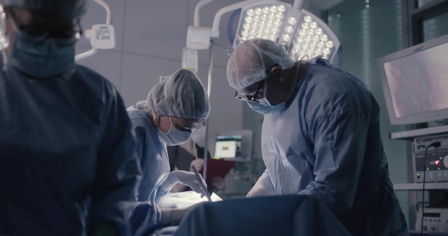 Doctors doing surgeon on a patient on the surgery room