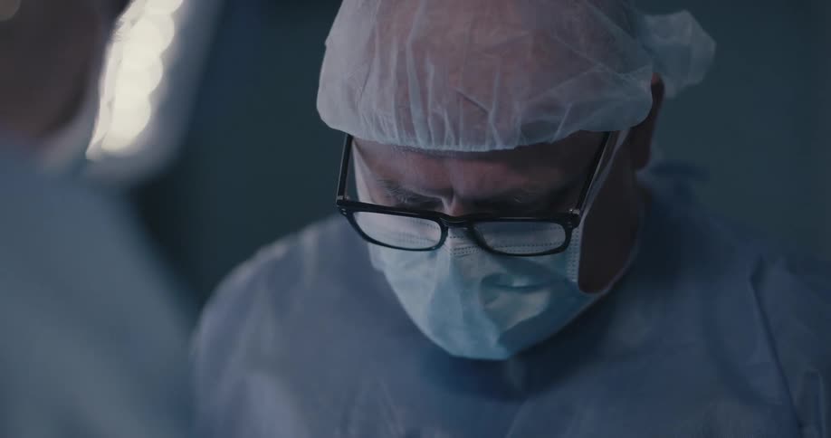 Two doctors are working in an operating room