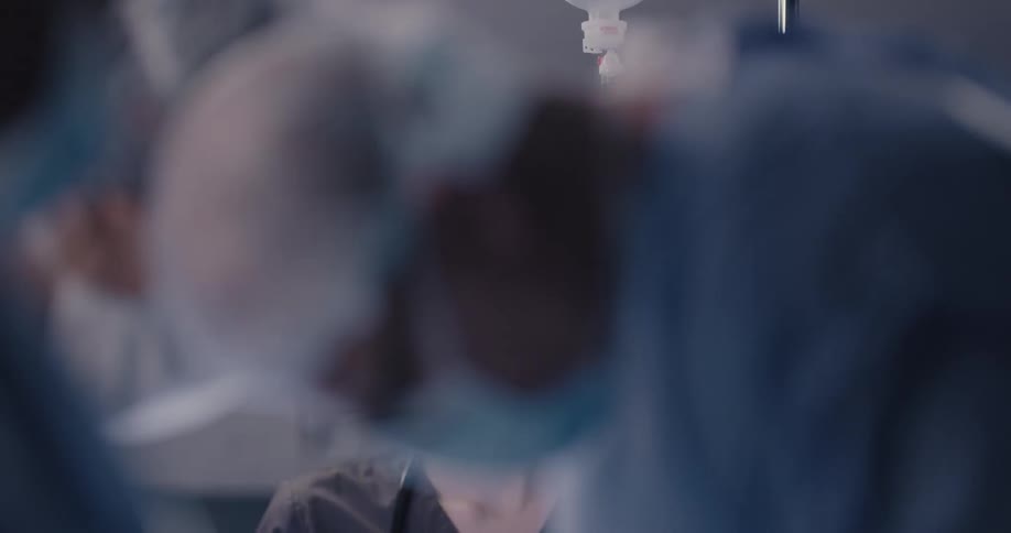 Doctors are performing surgery indoors