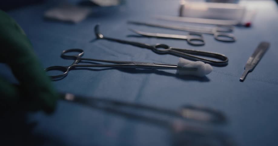 Surgeon arranging surgery equipment