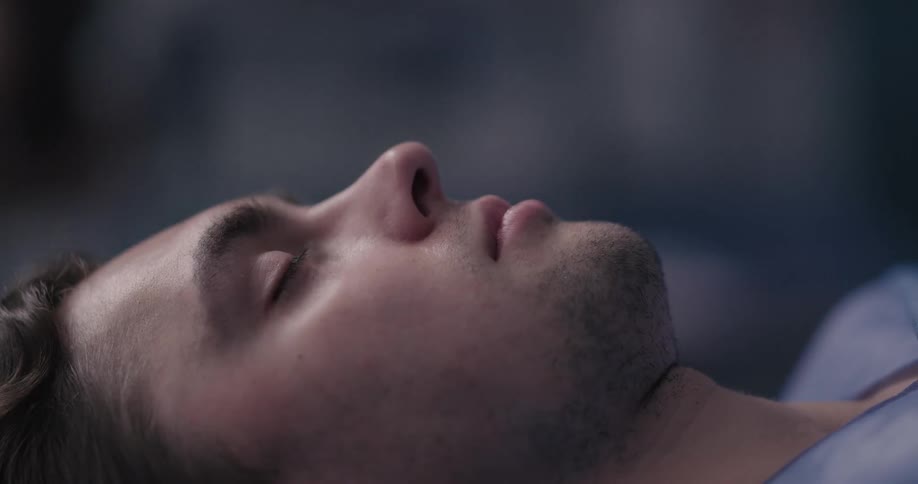 A man is laying down sleeping