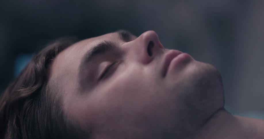 An unconscious white man
